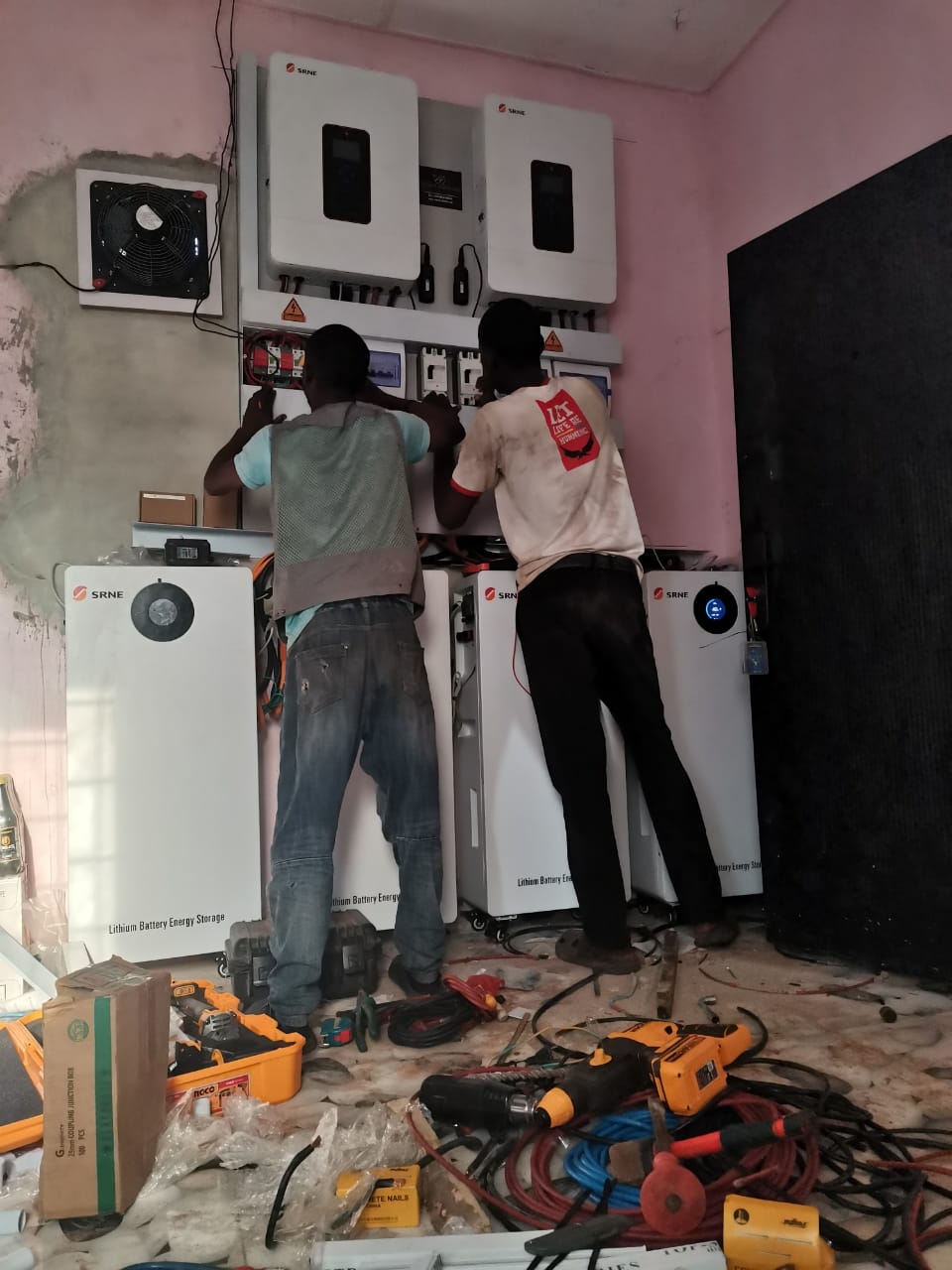 Technicians installing solar energy system